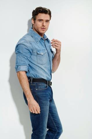 Image may contain Human Person Clothing Shirt Apparel Pants Richard Madden Denim and Jeans